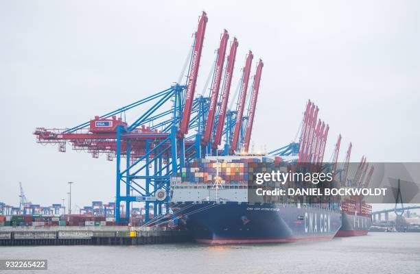 The container ship "Antoine de Saint Exupery" operated by the French CMA CGM shipping company moores at the Burchardkai terminal of the port of...