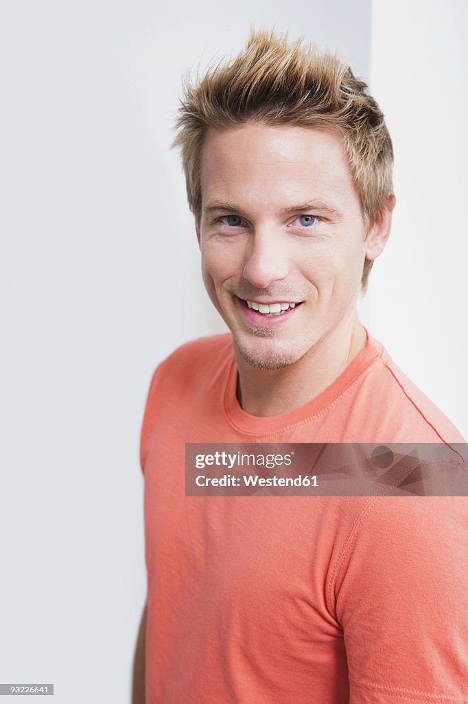 Young man smiling, portrait