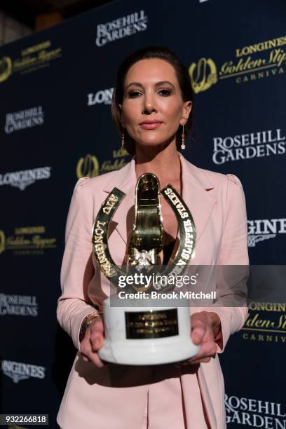 Kyly Clarke poses with the Golden Slipper trophy during A Night with the Slipper at The Emporium Parramatta on March 15, 2018 in Sydney, Australia.