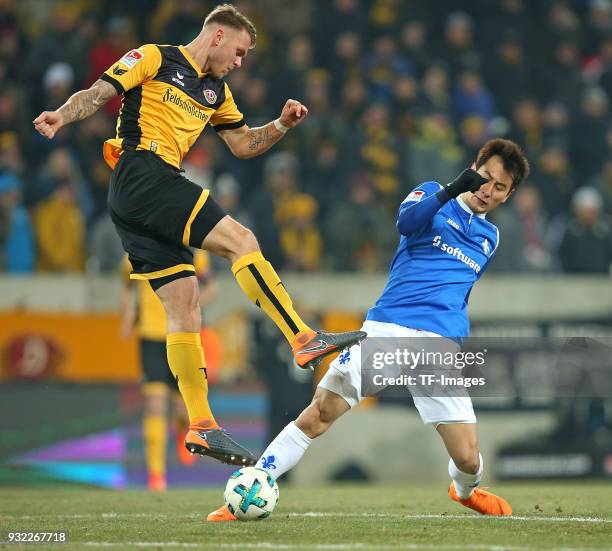 Marcel Franke of Dresden and Dong-Won Ji of Darmstadt battle for the ball during the Second Bundesliga match between SG Dynamo Dresden and SV...