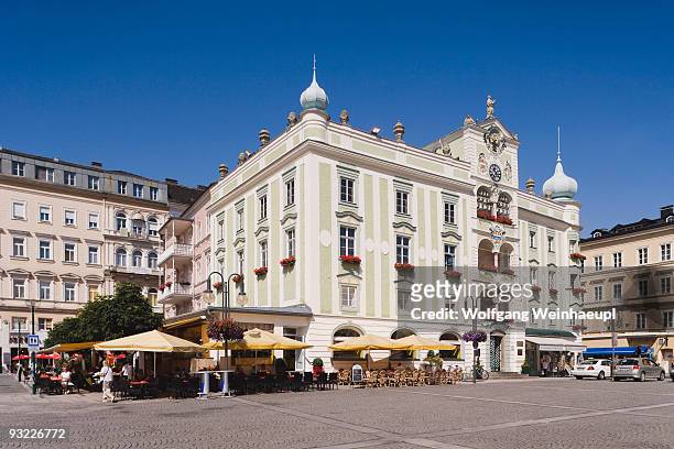 austria, gmunden, town hall with traditional glockenspiel - gmunden austria stock pictures, royalty-free photos & images