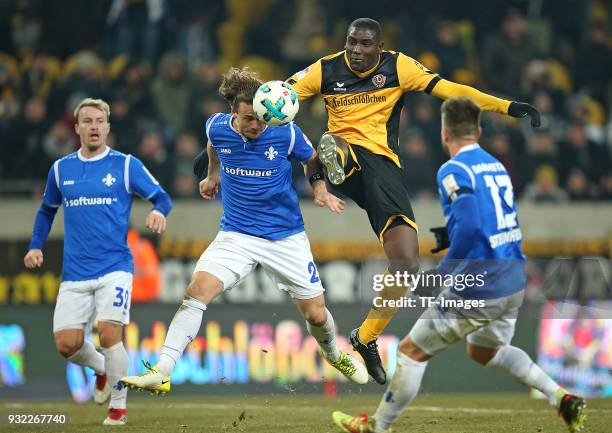 Fabian Holland of Darmstadt, Yannick Stark of Darmstadt, Peniel Mlapa of Dresden and Markus Steinhoefer of Darmstadt battle for the ball during the...