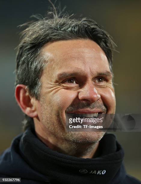 Head coach Dirk Schuster of Darmstadt laughs prior to the Second Bundesliga match between SG Dynamo Dresden and SV Darmstadt 98 at DDV-Stadion on...