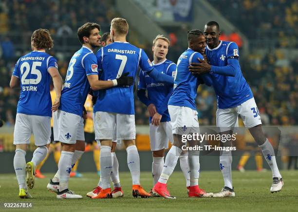 Joevin Jones of Darmstadt celebrates after scoring his team`s first goal with team mates during the Second Bundesliga match between SG Dynamo Dresden...