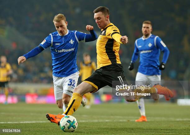 Fabian Holland of Darmstadt and Haris Duljevic of Dresden battle for the ball during the Second Bundesliga match between SG Dynamo Dresden and SV...