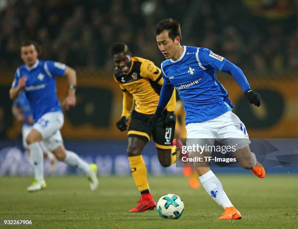 Moussa Kone of Dresden and Dong-Won Ji of Darmstadt battle for the ball during the Second Bundesliga match between SG Dynamo Dresden and SV Darmstadt...