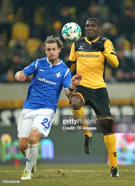 Yannick Stark of Darmstadt and Peniel Mlapa of Dresden battle for the ball during the Second Bundesliga match between SG Dynamo Dresden and SV...