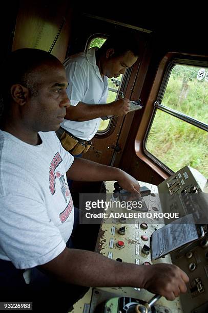 The guard and the driver of the Hershey's train work in Havana on November 17, 2009. In 1916 the Hershey Corporation of Pennsylvania built a network...