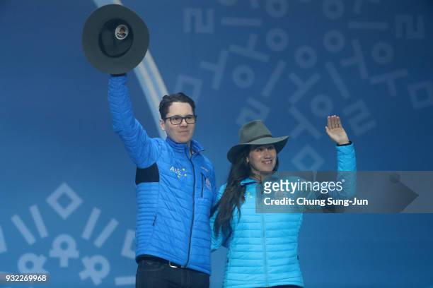 Bronze medallist Melissa Perrine of Australia and her guide Christian Geiger celebrate on the podium during the medal ceremony for the Alpien Skiing...