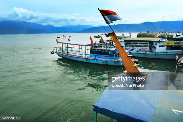 Ships to cross the Lake of Toba. Lake Toba is the largest volcanic lake in Southeast Asia. The lake is located in North Sumatra, Indonesia has a...