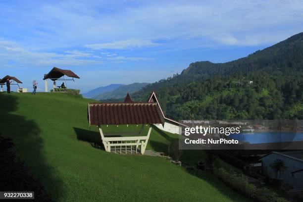 People relax with views of Lake Toba around them. Lake Toba is the largest volcanic lake in Southeast Asia. The lake is located in North Sumatra,...