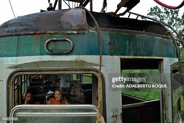 Passengers of the Hershey's train wait for the re-establishment of the electricity to continue the trip in Havana on November 17, 2009. In 1916 the...