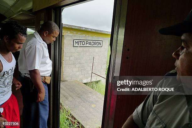 Guard of the Hershey's train open the doors in Havana on November 17, 2009. In 1916 the Hershey Corporation of Pennsylvania built a network of 135 km...