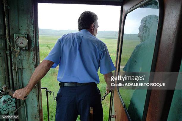 The driver of Hershey's train looks ouside during the tourist trip in Havana on November 17, 2009. In 1916 the Hershey Corporation of Pennsylvania...