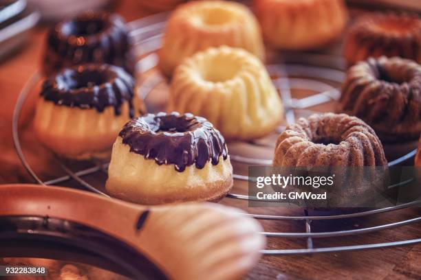 preparing small easter bunt cakes - small bakery stock pictures, royalty-free photos & images