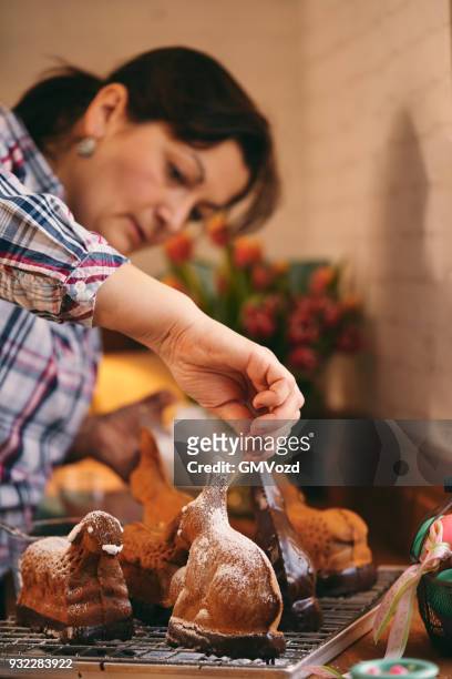 preparing easter lamb cake in domestic kitchen - easter lamb stock pictures, royalty-free photos & images