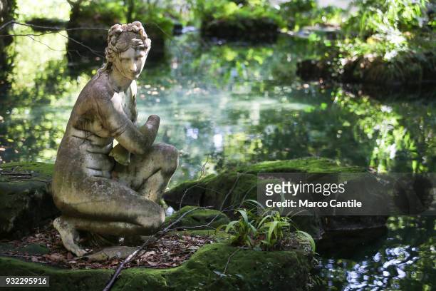 View of the statue of Venus in the pond of english garden, inside the park of the Royal Palace of Caserta.