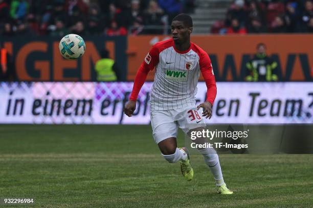 Kevin Danso of Augsburg looks the ball during the Bundesliga match between FC Augsburg and TSG 1899 Hoffenheim at WWK Arena on March 03, 2018 in...