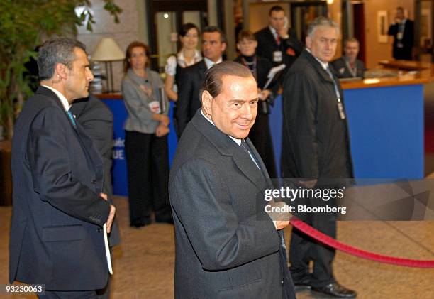 Silvio Berlusconi, Italy's prime minister, arrives for the European Union Summit at the EU headquarters in Brussels, Belgium, on Thursday, Nov. 19,...