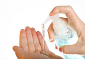 Woman applying hand sanitizer or soap