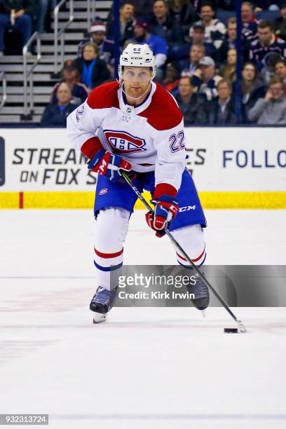 Karl Alzner of the Montreal Canadiens controls the puck during the game against the Columbus Blue Jackets on March 12, 2018 at Nationwide Arena in...