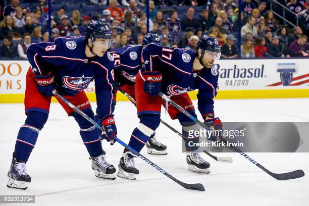 Zach Werenski of the Columbus Blue Jackets and Brandon Dubinsky of the Columbus Blue Jackets line up for a face-off during the game against the...