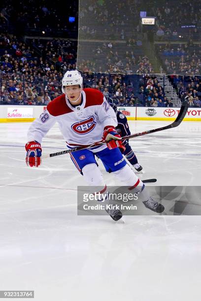 Mike Reilly of the Montreal Canadiens skates after the puck during the game against the Columbus Blue Jackets on March 12, 2018 at Nationwide Arena...