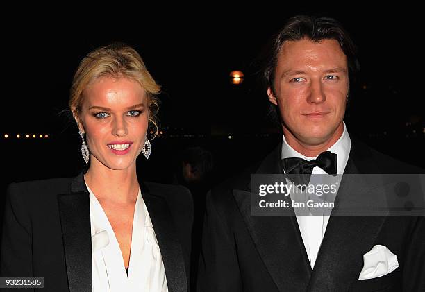 Model Eva Herzigova and guest arrive at the 2010 Pirelli Calendar launch party at Old Billingsgate on November 19, 2009 in London, England.