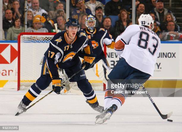 Tyler Myers of the Buffalo Sabres defends against Ales Hemsky of the Edmonton Oilers on November 11, 2009 at HSBC Arena in Buffalo, New York. The...