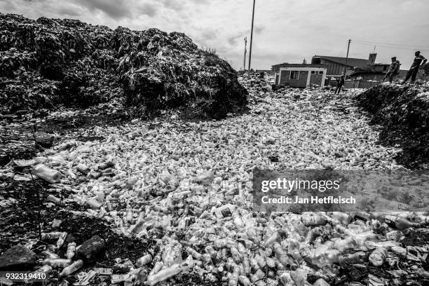Thousands of plastic bottles lay on the ground at the Dandora rubbish dump on March 14, 2018 in Nairobi, Kenya. The Dandora landfield is located 8...