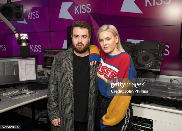 Anne Marie poses with Kiss presenter Tom Green during a visit to Kiss FM Studio's on March 15, 2018 in London, England.