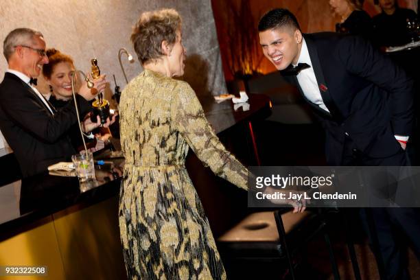 March 4, 2018--Frances McDormand, with her son Pedro, waiting for her Best Actress Oscar to be engraved, at the Governor's Ball of the 90th Academy...