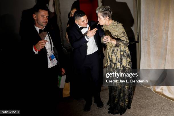 March 4, 2018--Frances McDormand is fed a shrimp by her son Pedro, as they leave after having her Best Actress Oscar engraved, at the Governor's Ball...