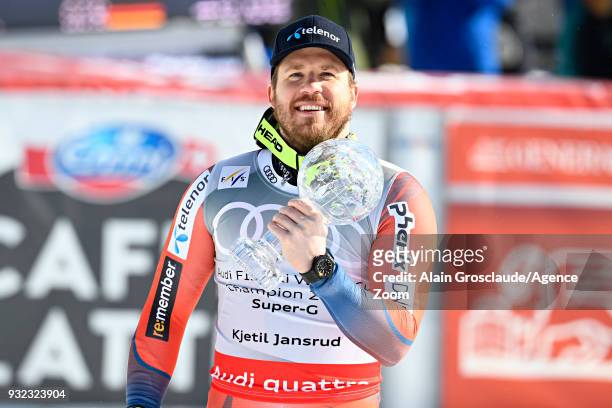 Kjetil Jansrud of Norway wins the globe in the men super G standing during the Audi FIS Alpine Ski World Cup Finals Men's and Women's Super G on...