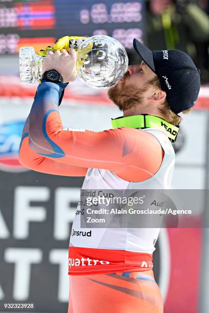 Kjetil Jansrud of Norway wins the globe in the men super G standing during the Audi FIS Alpine Ski World Cup Finals Men's and Women's Super G on...