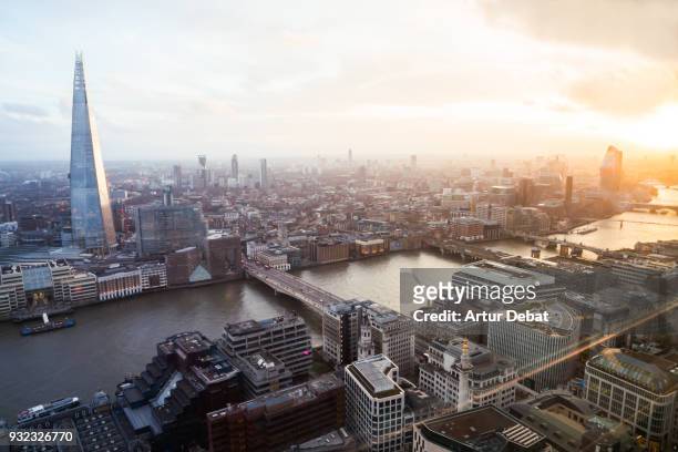the city of london skyline with the shard tower during sunset with blue and orange colors. - views of london from the shard tower stock-fotos und bilder