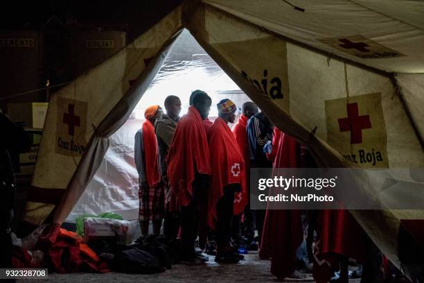 The Spanish Red Cross attending 48 migrants at the Harbour of Malaga on 14 March 2018 in Malaga, Spain. Late in the afternoon, 48 migrants among them...