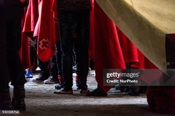 The Spanish Red Cross attending 48 migrants at the Harbour of Malaga on 14 March 2018 in Malaga, Spain. Late in the afternoon, 48 migrants among them...