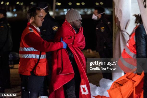 The Spanish Red Cross attending 48 migrants at the Harbour of Malaga on 14 March 2018 in Malaga, Spain. Late in the afternoon, 48 migrants among them...