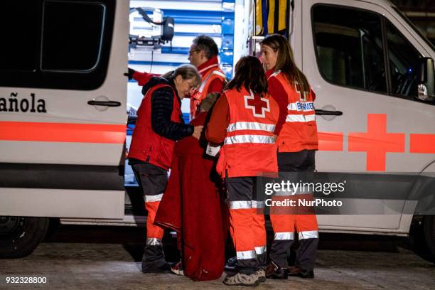 The Spanish Red Cross attending 48 migrants at the Harbour of Malaga on 14 March 2018 in Malaga, Spain. Late in the afternoon, 48 migrants among them...