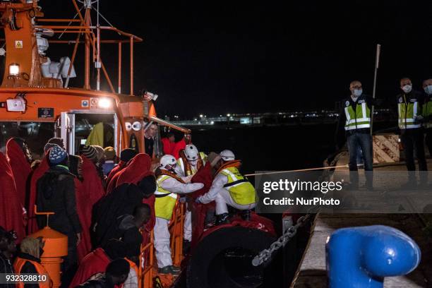 The Spanish Red Cross attending 48 migrants at the Harbour of Malaga on 14 March 2018 in Malaga, Spain. Late in the afternoon, 48 migrants among them...