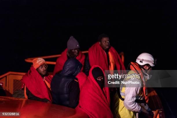The Spanish Red Cross attending 48 migrants at the Harbour of Malaga on 14 March 2018 in Malaga, Spain. Late in the afternoon, 48 migrants among them...