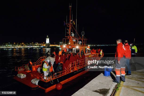 The Spanish Red Cross attending 48 migrants at the Harbour of Malaga on 14 March 2018 in Malaga, Spain. Late in the afternoon, 48 migrants among them...