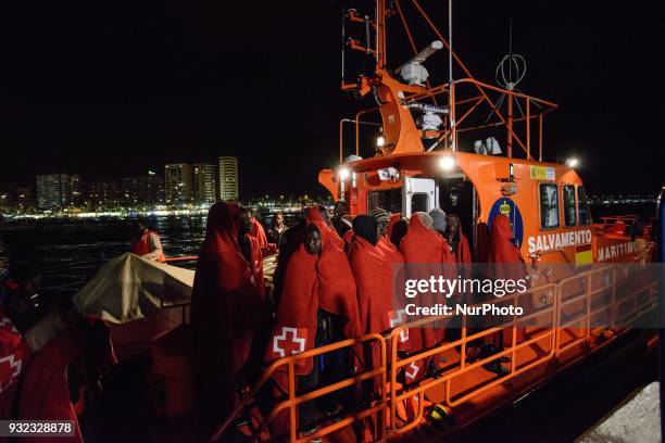 The Spanish Red Cross attending 48 migrants at the Harbour of Malaga on 14 March 2018 in Malaga, Spain. Late in the afternoon, 48 migrants among them...