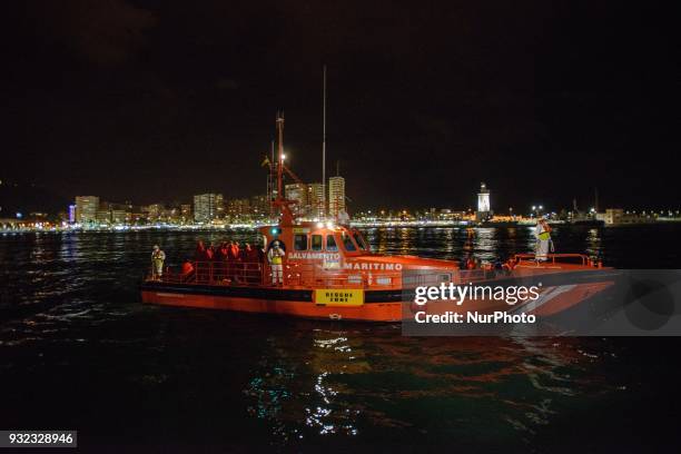 The Spanish Red Cross attending 48 migrants at the Harbour of Malaga on 14 March 2018 in Malaga, Spain. Late in the afternoon, 48 migrants among them...