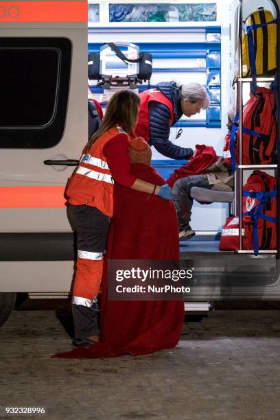 The Spanish Red Cross attending 48 migrants at the Harbour of Malaga on 14 March 2018 in Malaga, Spain. Late in the afternoon, 48 migrants among them...