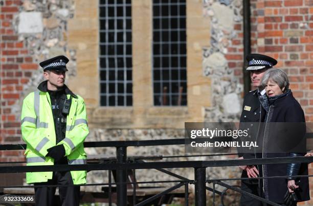 Britain's Prime Minister Theresa May talks with Wiltshire Police's Chief Constable Kier Pritchard as they walk near The Mill Pub in Salisbury,...