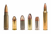 6 different bullets standing on a white background