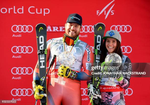 The men's overall season's Super-G winner Norway's Kjetil Jansrud an the women's overall season's Super-G Liechtenstein's Tina Weirather pose with...