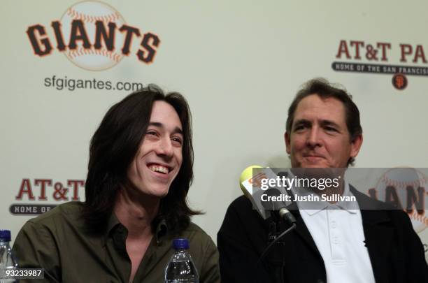 San Francisco Giants pitcher Tim Lincecum smiles during a news conference as Giants pitching coach Dave Righetti looks on November 19, 2009 at AT&T...